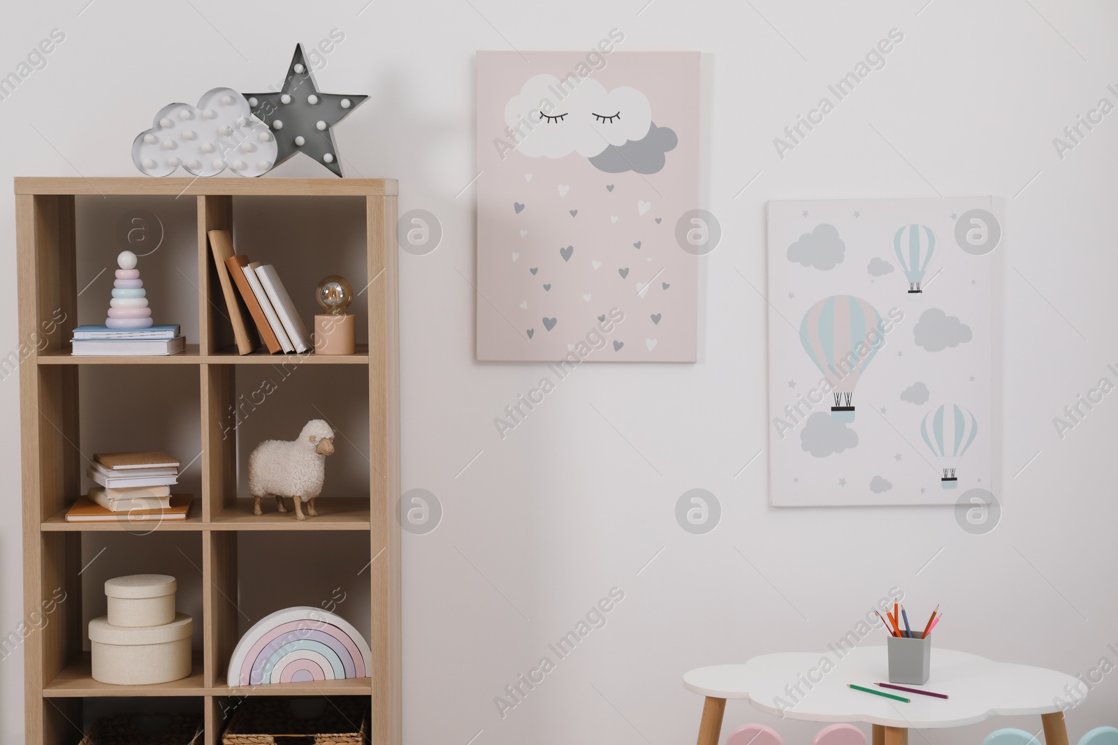 Photo of Child's room interior with modern furniture and beautiful pictures on wall