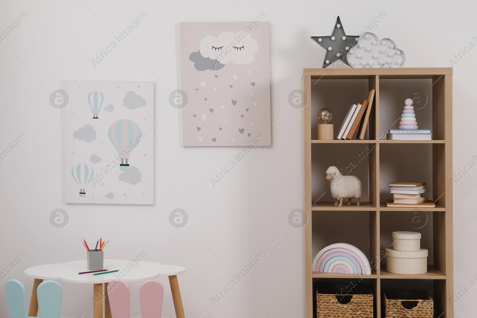 Photo of Child's room interior with modern furniture and beautiful pictures on wall