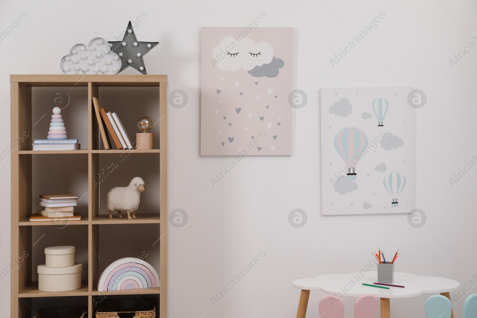 Photo of Child's room interior with modern furniture and beautiful pictures on wall