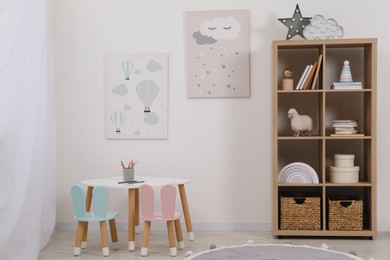 Photo of Child's room interior with modern furniture and beautiful pictures on wall