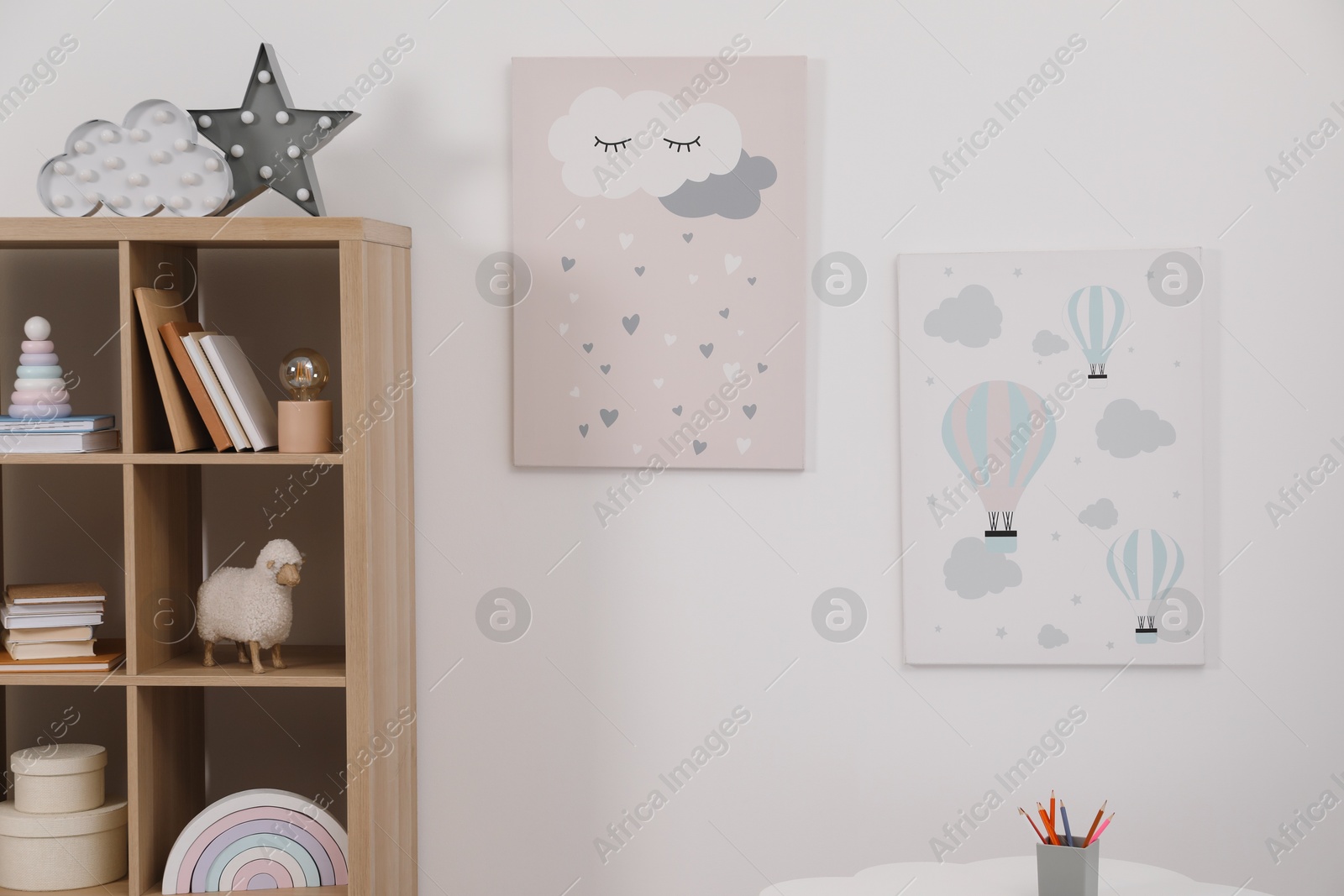 Photo of Child's room interior with modern furniture and beautiful pictures on wall