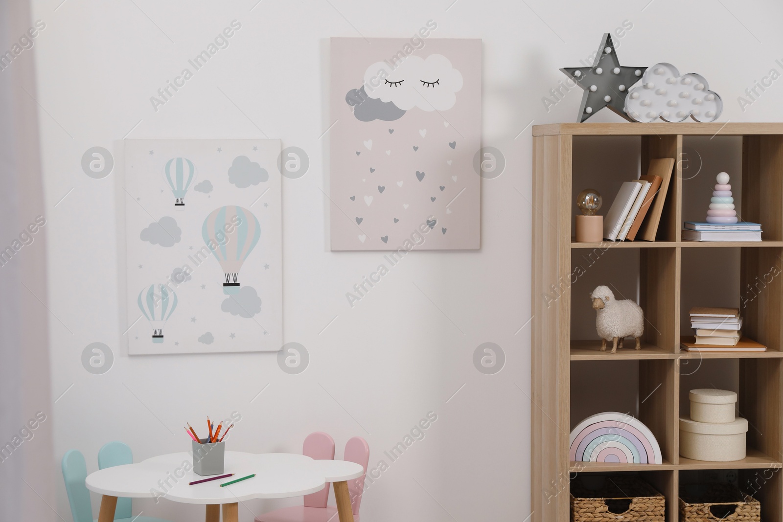 Photo of Child's room interior with modern furniture and beautiful pictures on wall