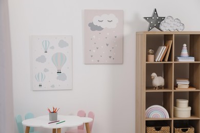 Child's room interior with modern furniture and beautiful pictures on wall