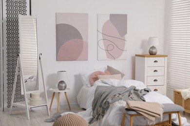 Teen's room interior with modern furniture and beautiful pictures on wall