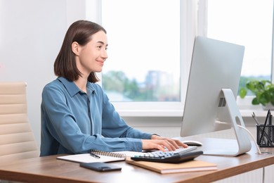 Woman with good posture working in office