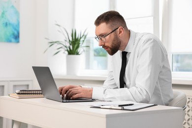 Man with poor posture working in office