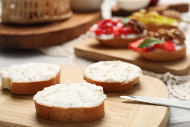 Photo of Delicious bruschettas with ricotta cheese on table, closeup