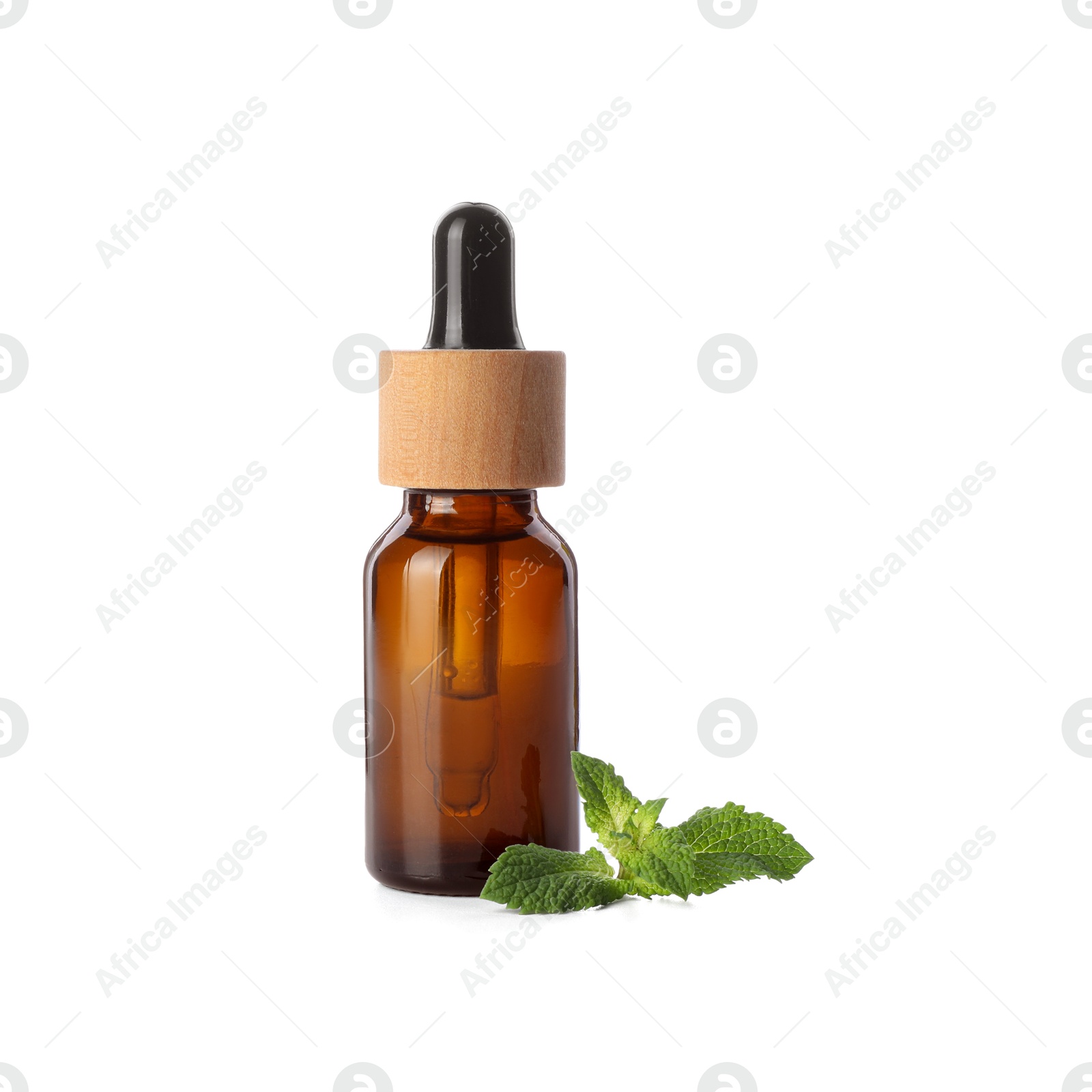 Photo of Bottle of essential oil and mint isolated on white