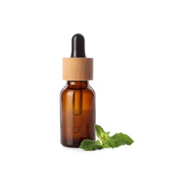 Photo of Bottle of essential oil and mint isolated on white