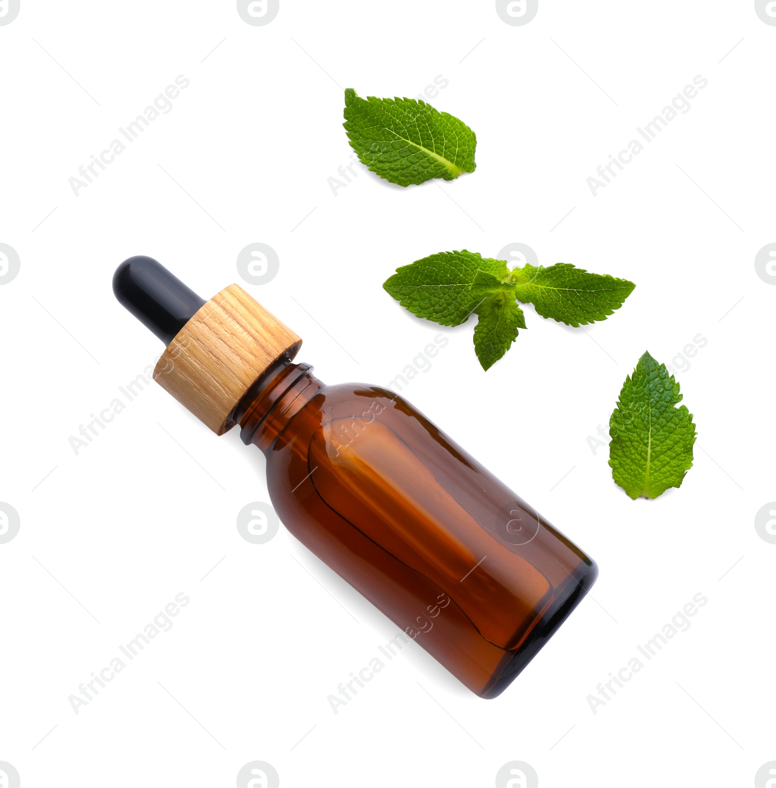 Photo of Bottle of essential oil and mint isolated on white, top view