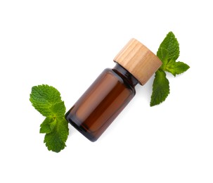 Photo of Bottle of essential oil and mint isolated on white, top view