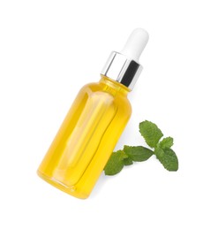 Photo of Bottle of essential oil and mint isolated on white, top view