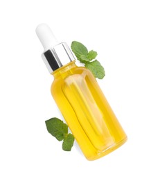 Photo of Bottle of essential oil and mint isolated on white, top view