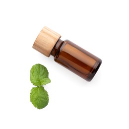 Photo of Bottle of essential oil and mint isolated on white, top view