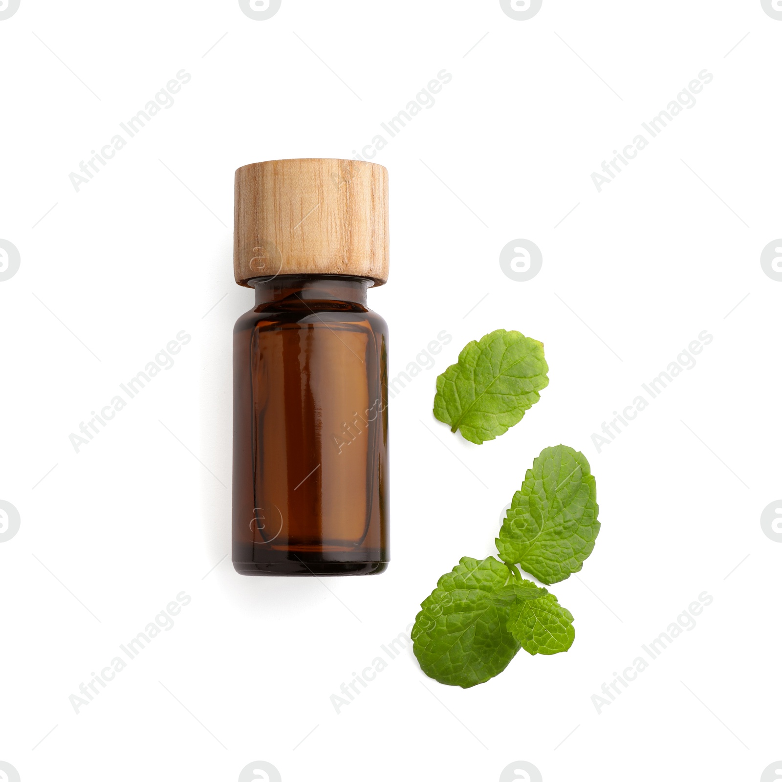 Photo of Bottle of essential oil and mint isolated on white, top view