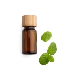 Photo of Bottle of essential oil and mint isolated on white, top view