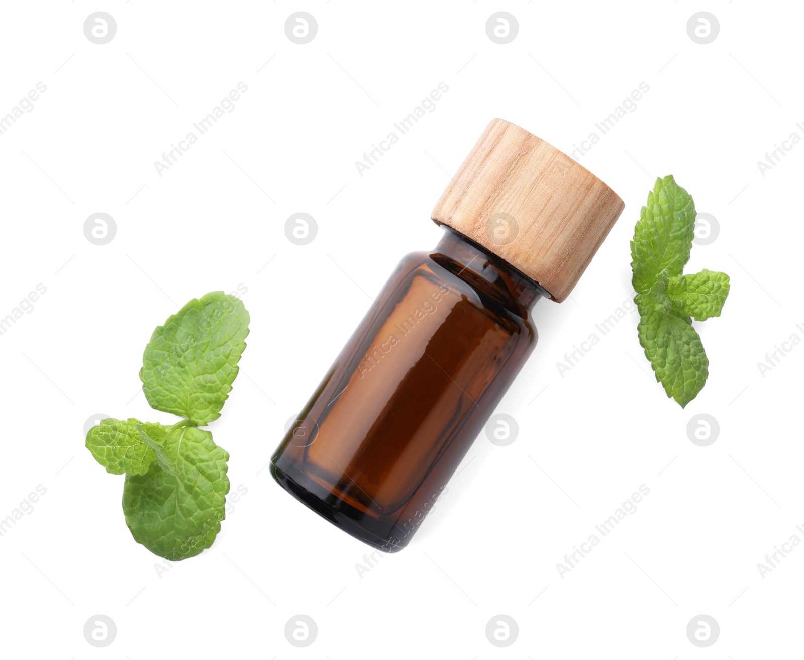 Photo of Bottle of essential oil and mint isolated on white, top view