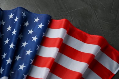 Flag of USA on black table, top view