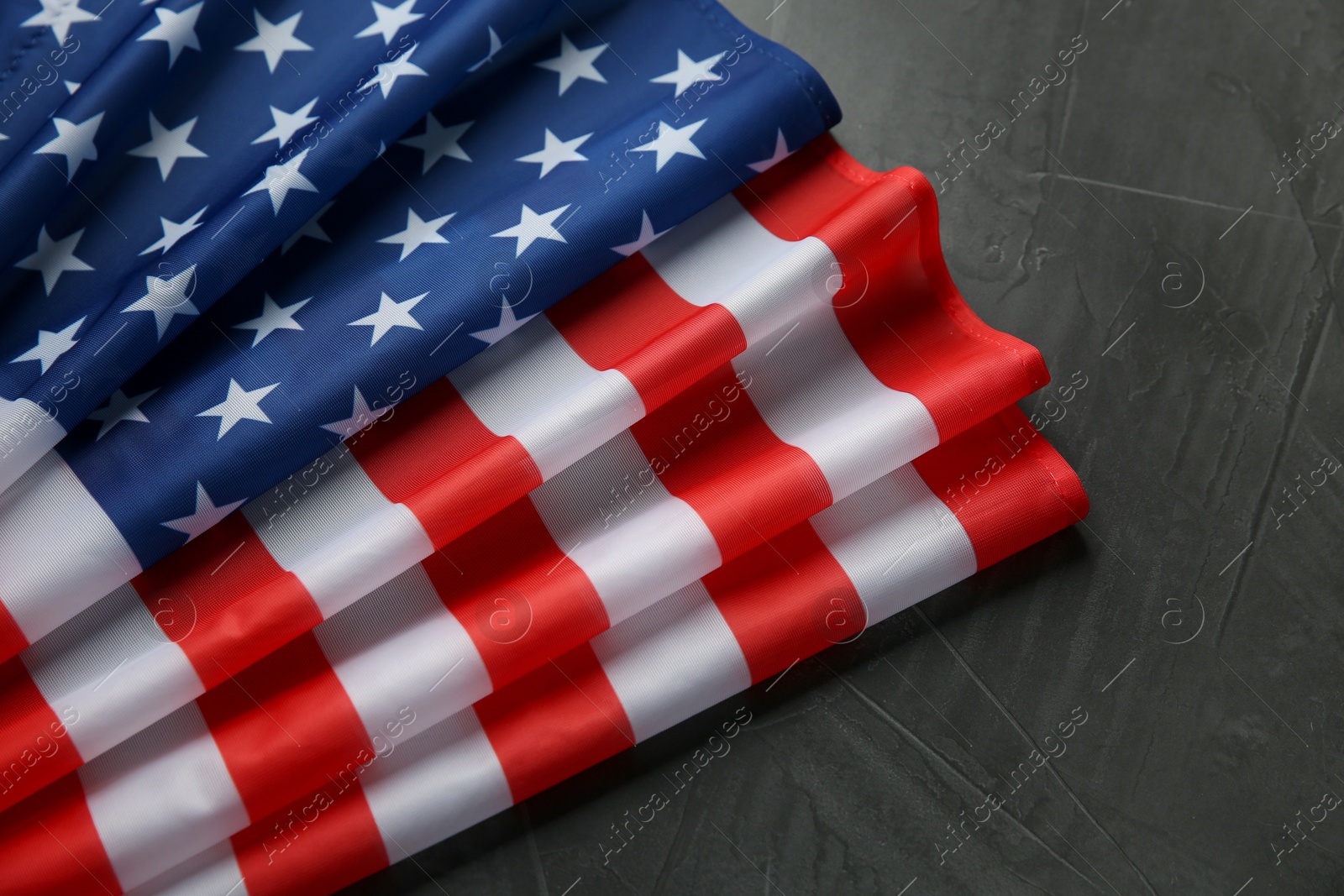 Photo of Flag of USA on black table, top view