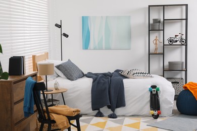 Photo of Teen's room interior with modern furniture and beautiful picture on wall