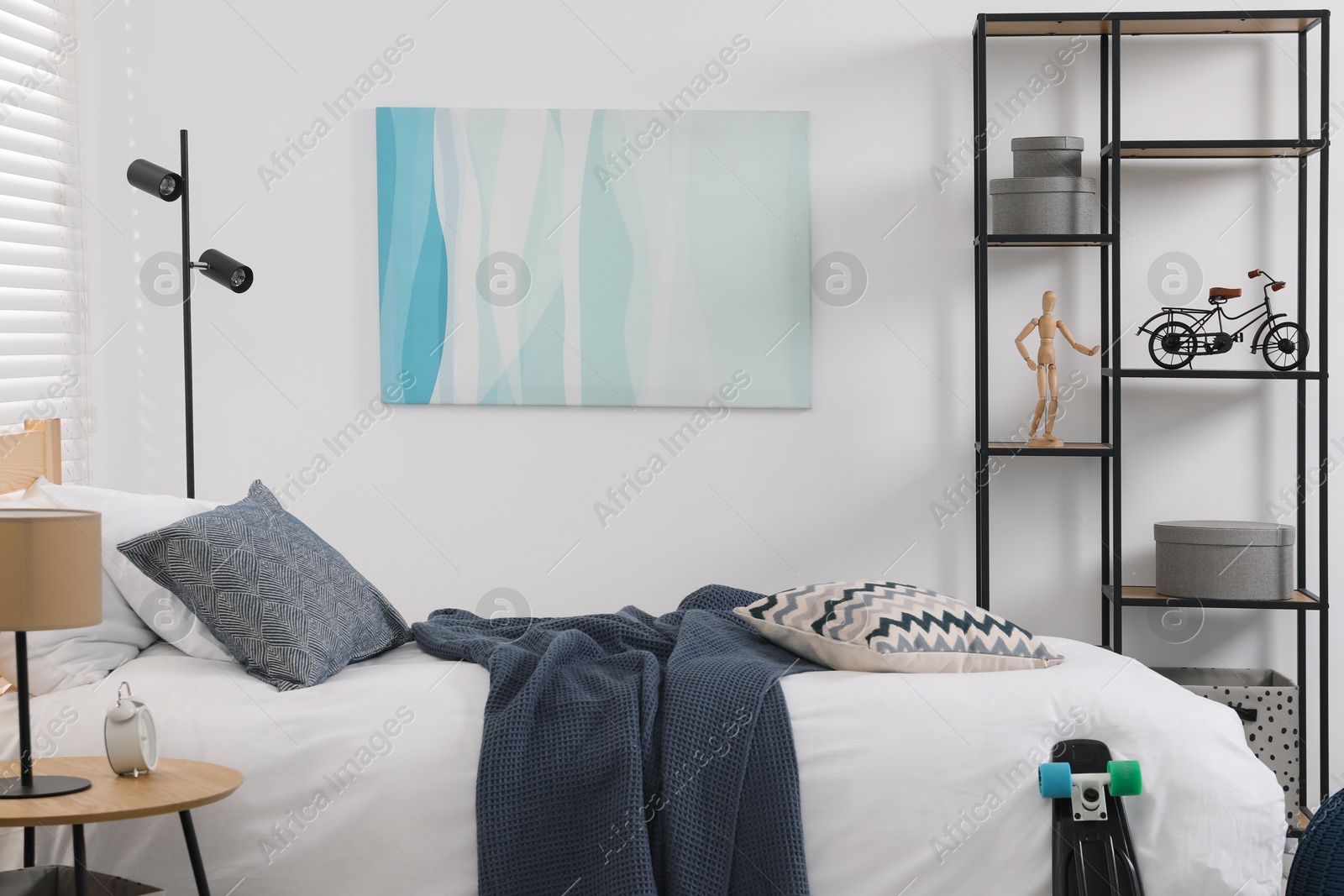 Photo of Teen's room interior with modern furniture and beautiful picture on wall