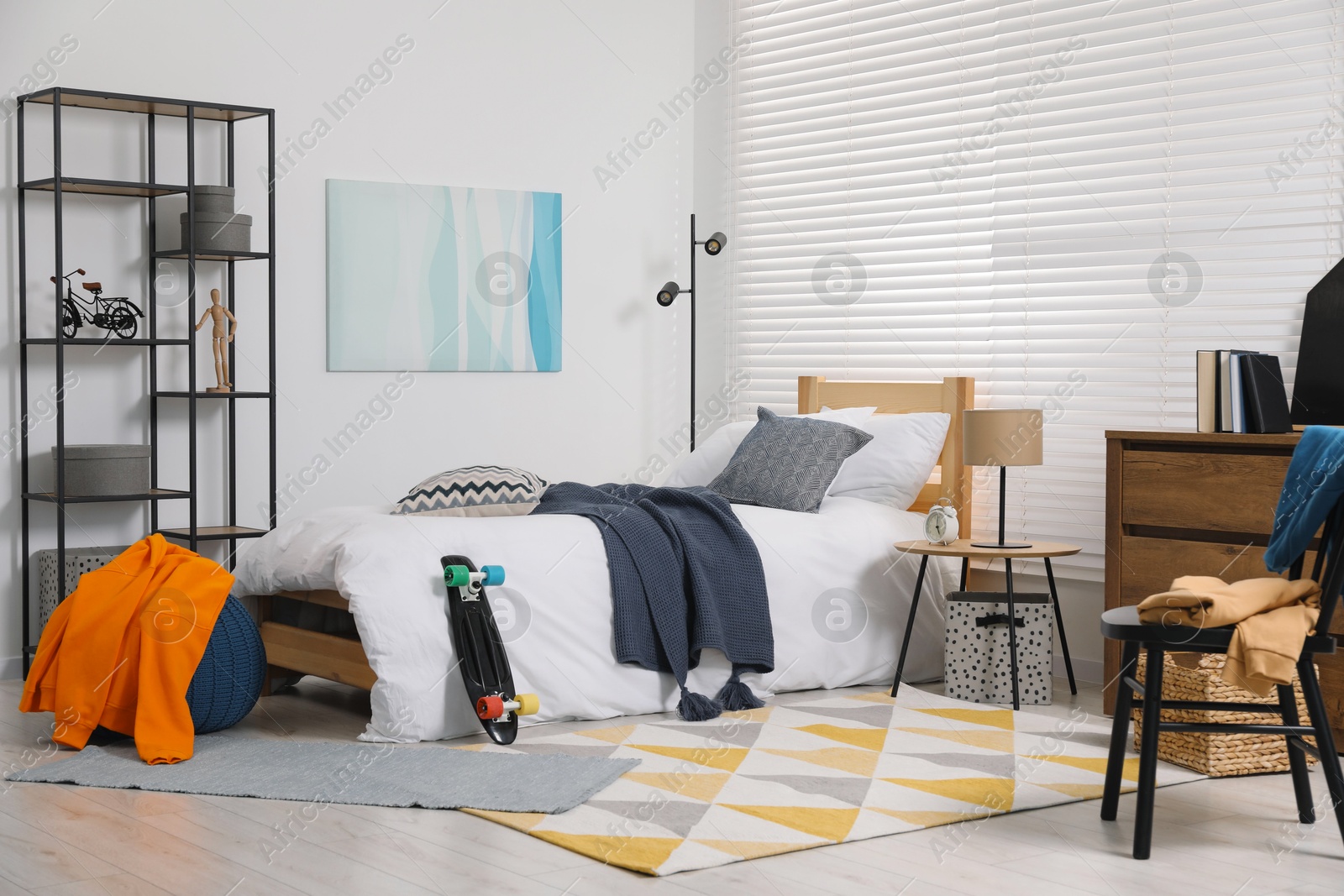 Photo of Teen's room interior with modern furniture and beautiful picture on wall