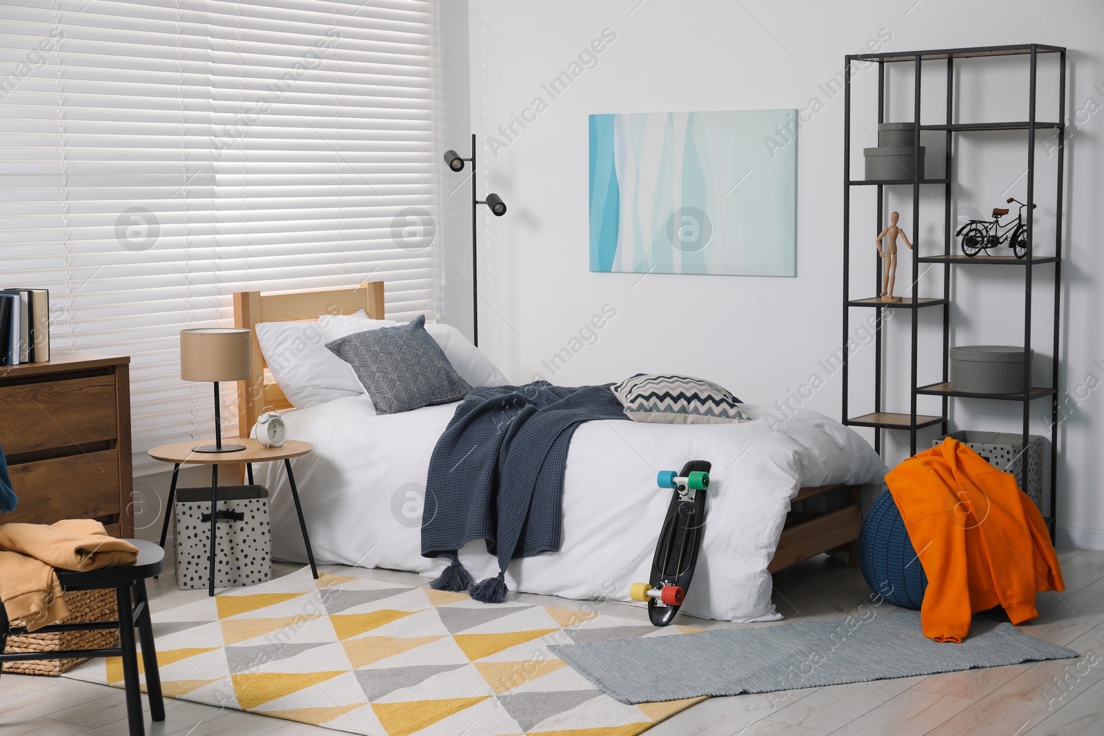 Photo of Teen's room interior with modern furniture and beautiful picture on wall