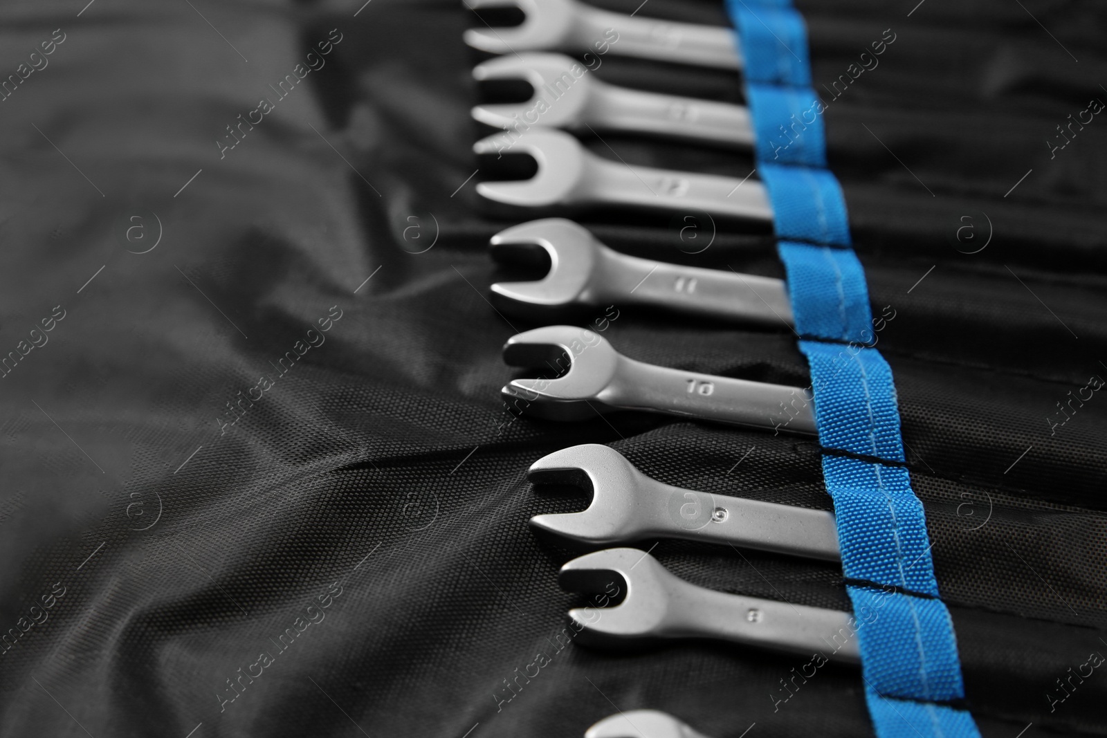 Photo of Many auto mechanic's tools in case, closeup