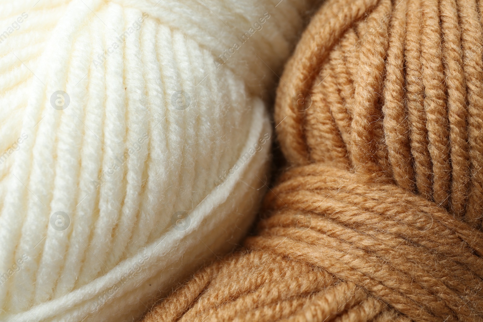 Photo of Two skeins of yarn as background, closeup view. Knitting material