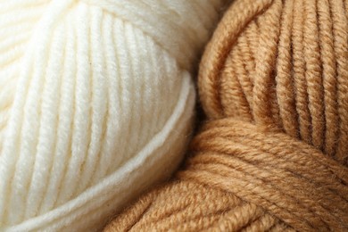 Photo of Two skeins of yarn as background, closeup view. Knitting material