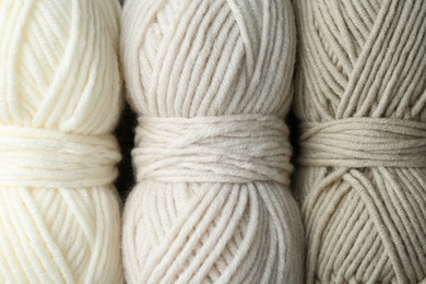 Three skeins of yarn as background, top view. Knitting material