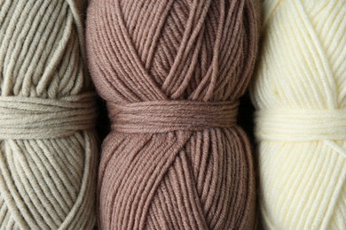 Three skeins of yarn as background, top view. Knitting material