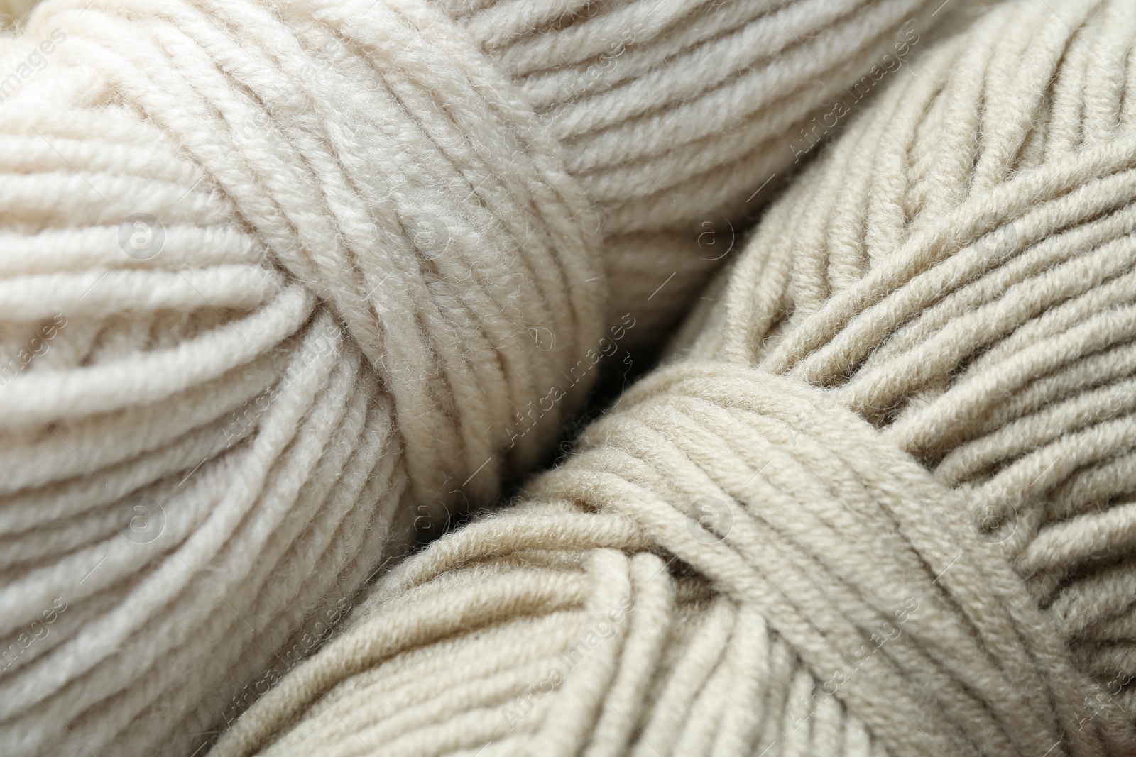 Photo of Two skeins of yarn as background, above view. Knitting material