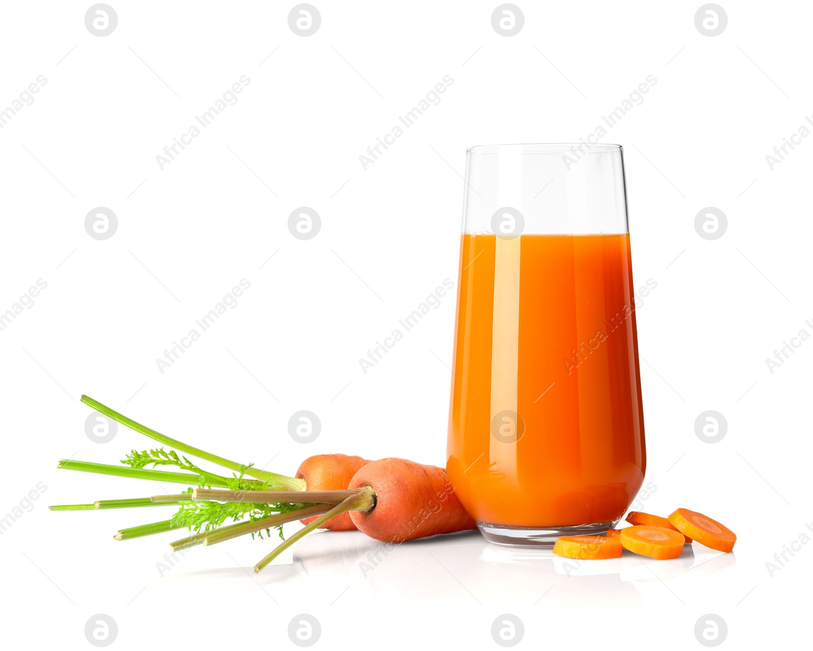 Photo of Healthy carrot juice in glass and fresh vegetables isolated on white