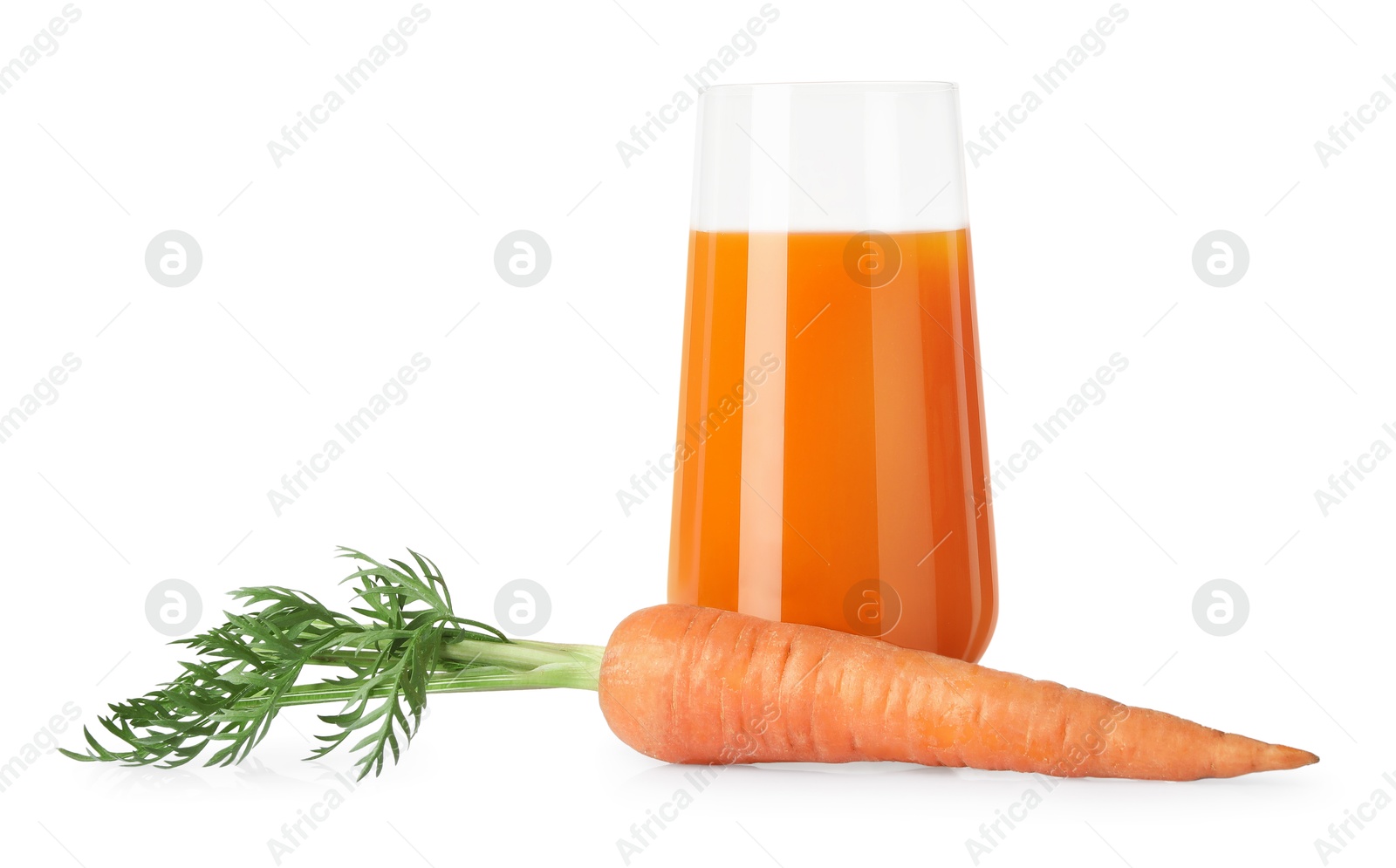 Photo of Healthy carrot juice in glass and fresh vegetable isolated on white