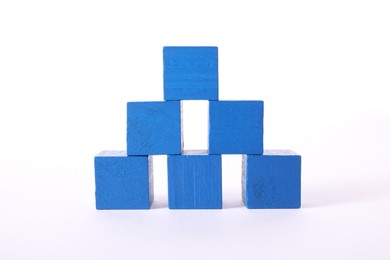 Many blue wooden cubes on white background