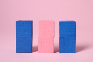 Photo of Many blank colorful cubes on pink background