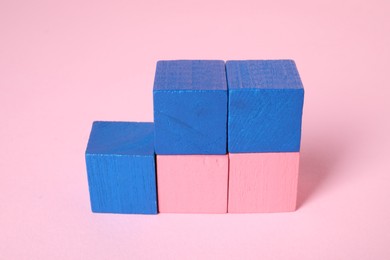 Photo of Many blank colorful cubes on pink background