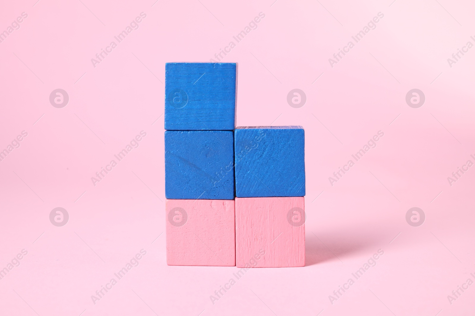 Photo of Many blank colorful cubes on pink background