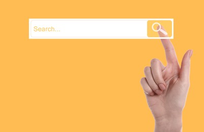 Image of Woman using search bar on virtual screen against orange background, closeup