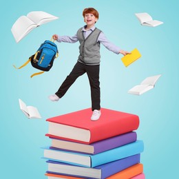 Image of Happy schoolboy with backpack and textbook on stack of books against light blue background. Back to school