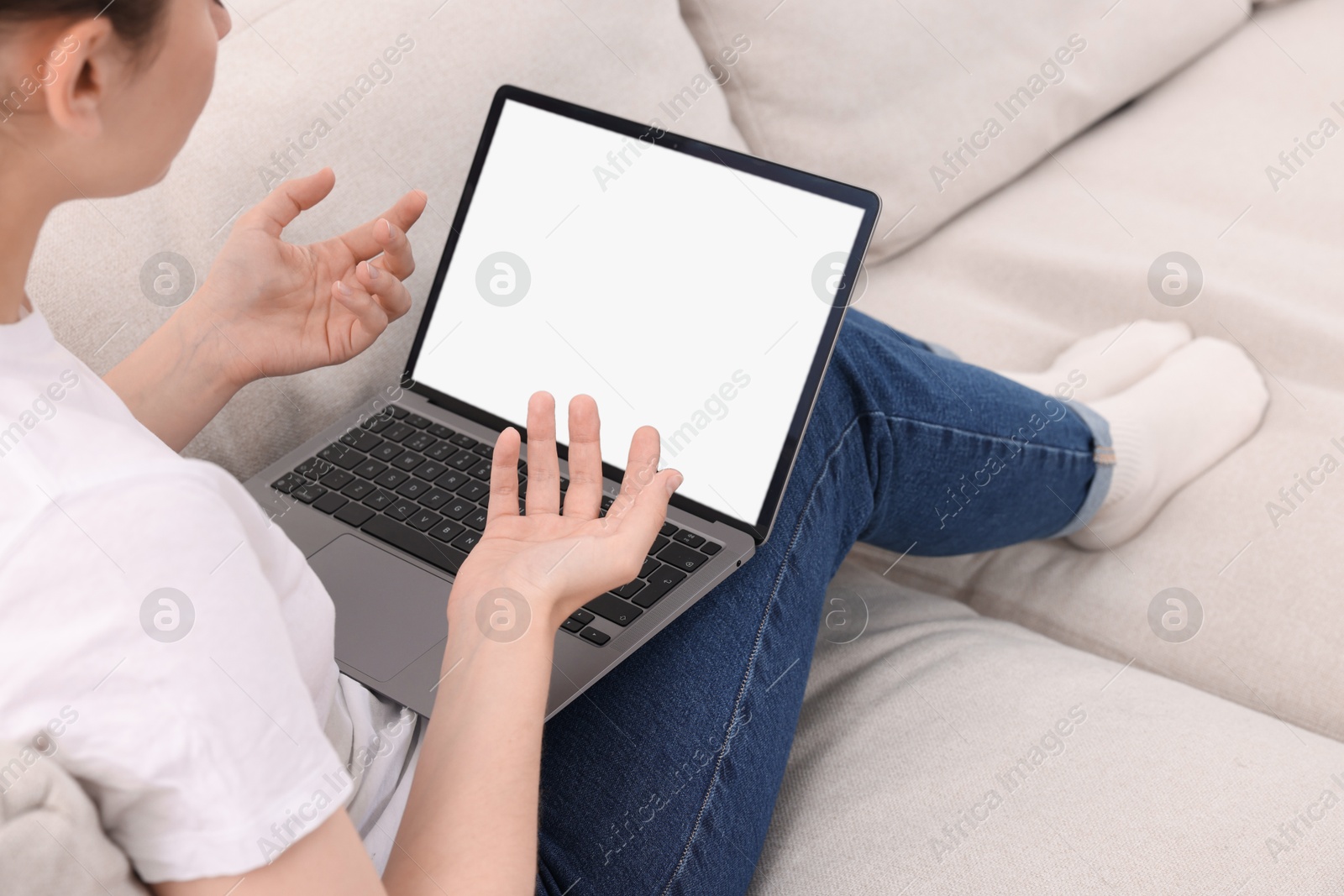 Photo of Sick woman having online consultation with doctor via laptop at home