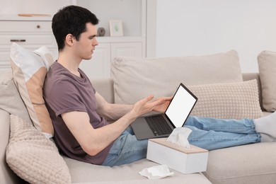 Photo of Sick man having online consultation with doctor via laptop at home