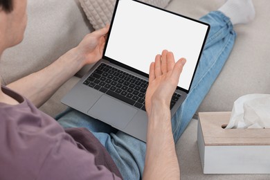 Photo of Sick man having online consultation with doctor via laptop at home, closeup