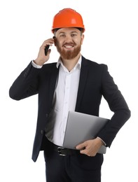 Photo of Engineer in hard hat with laptop talking on smartphone against white background