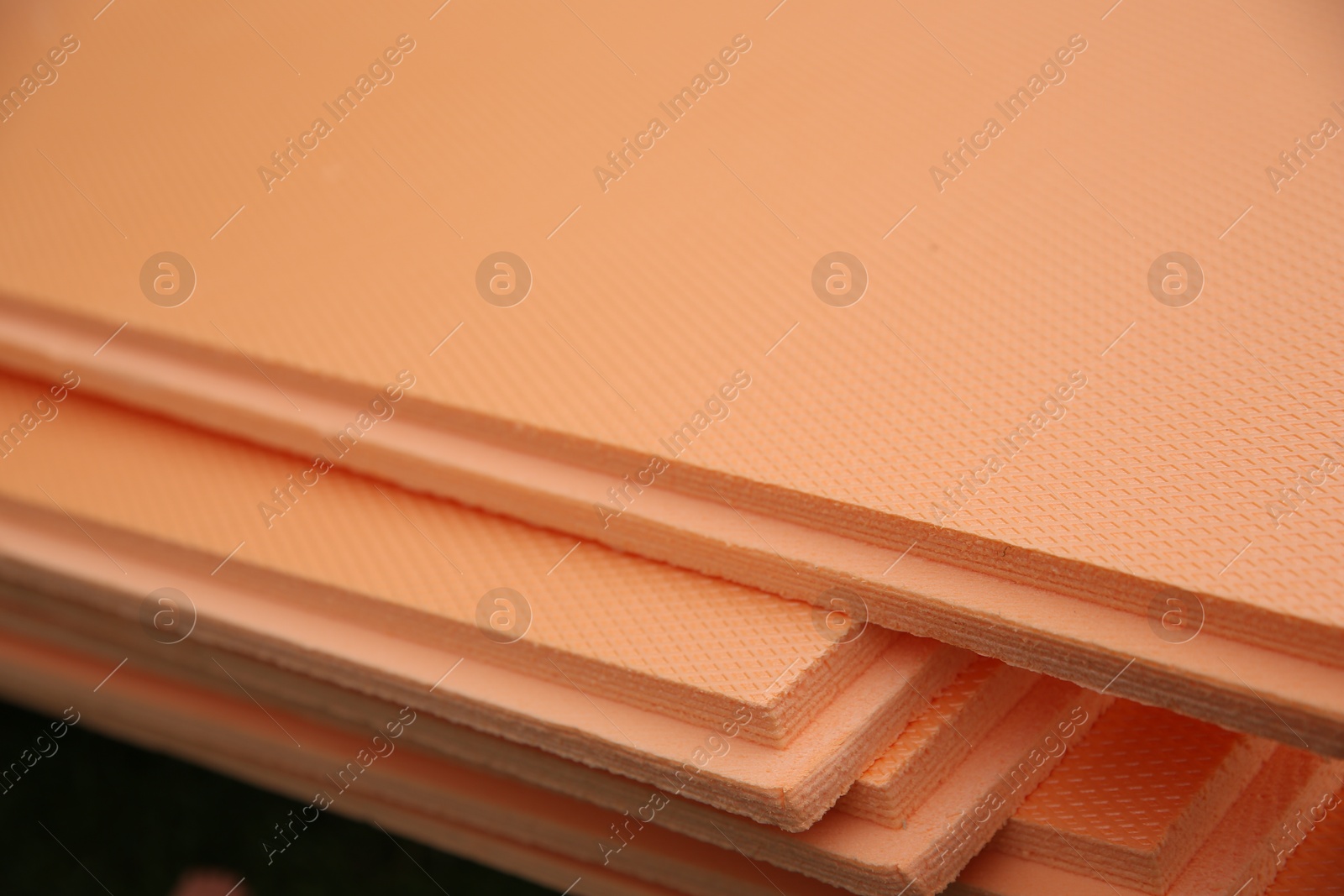 Photo of Under pool foam tiles in backyard, closeup