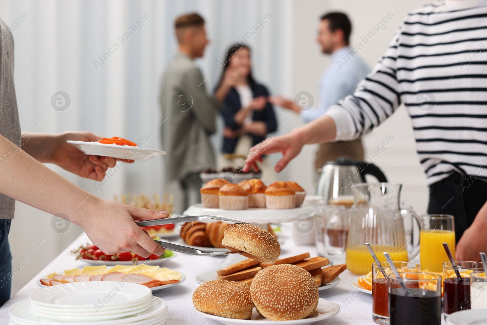 Photo of Coworkers having business lunch in restaurant, closeup