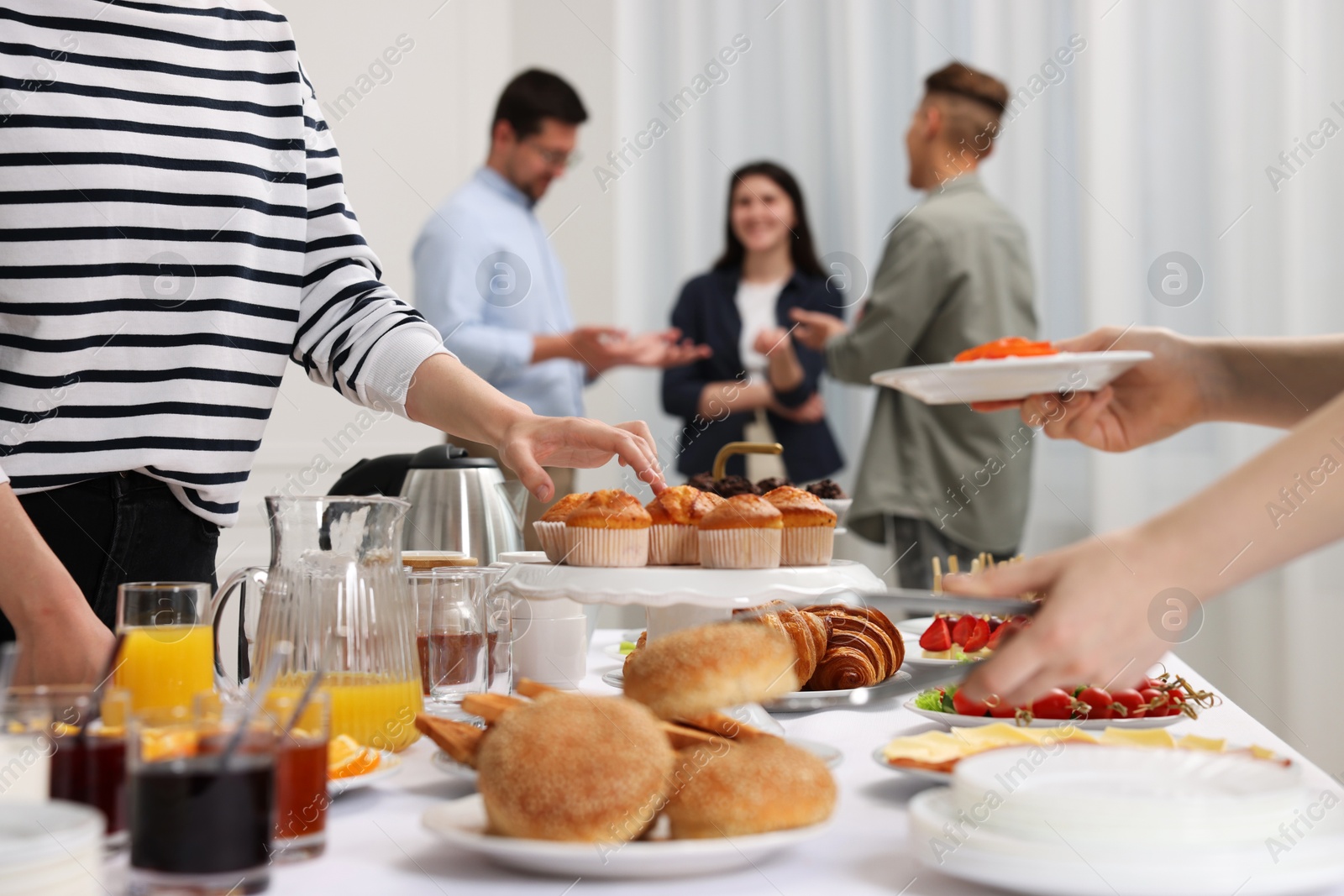 Photo of Coworkers having business lunch in restaurant, closeup