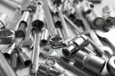 Auto mechanic's tools on white table, closeup