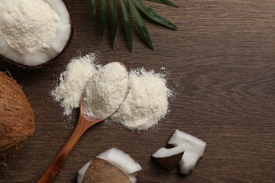 Photo of Coconut flour, fresh fruits and leaf on wooden table, flat lay. Space for text